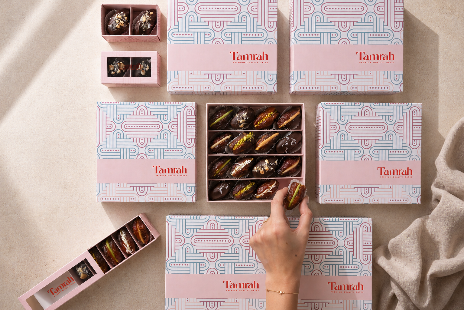Tamrah boxes shared on a table